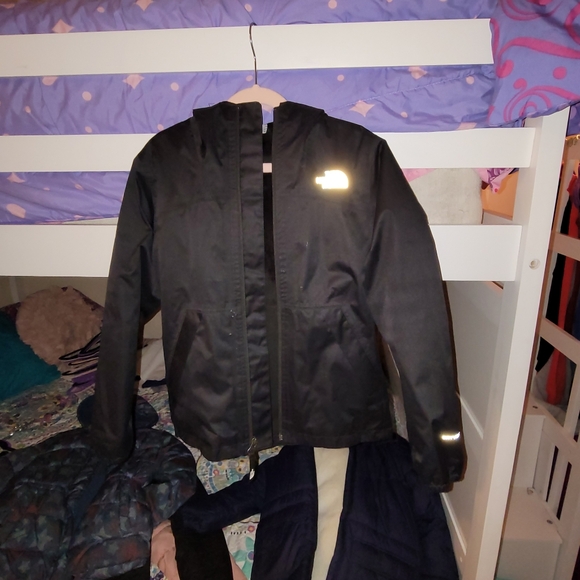 The Northface size 7/8 rain jacket lined inside black.